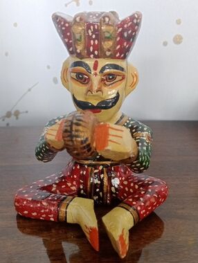 Hand-Painted Red and Green Folk Art Seated Musician Figurine